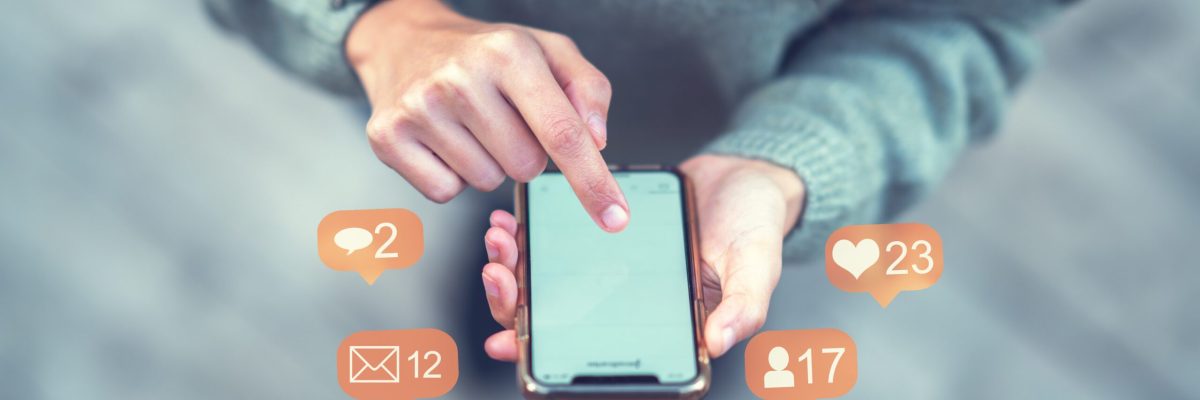 Close-up image of woman hands using smartphone and social networ