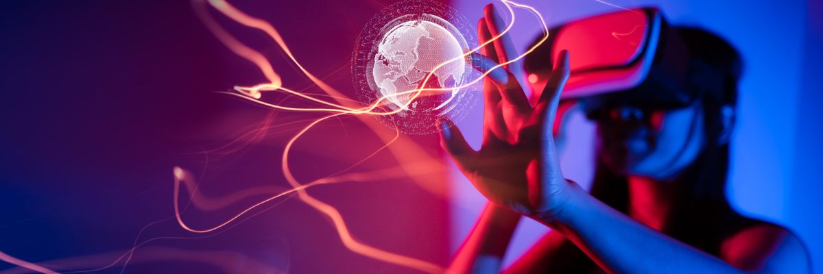 Young woman using glasses of virtual reality on dark background. Smartphone using with VR headset,virtual reality,future technology concept.Asian woman using VR glasses in colorful neon lights.