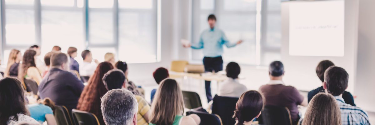 Speakers Giving a Talk at Business Meeting. Audience in the conference hall. Business and Entrepreneurship concept.